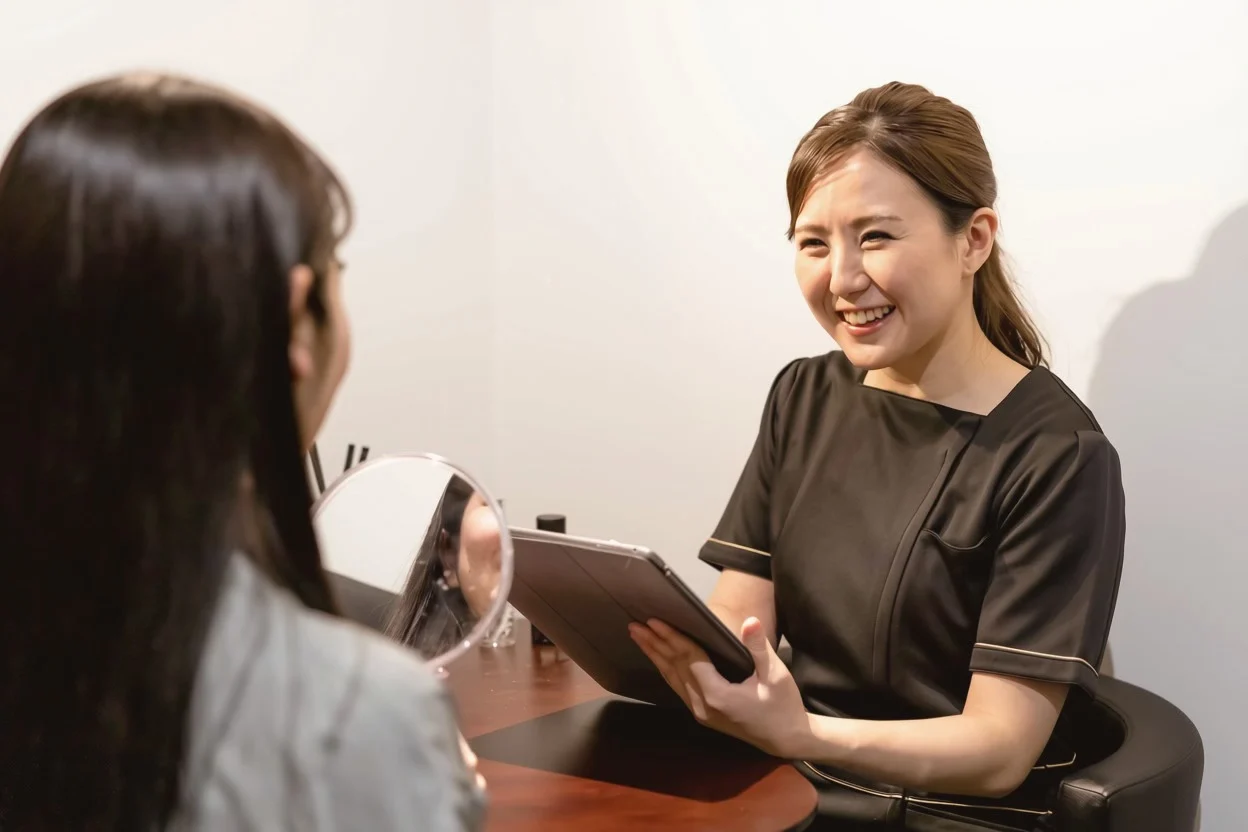 Aesthetic provider consulting with a client
